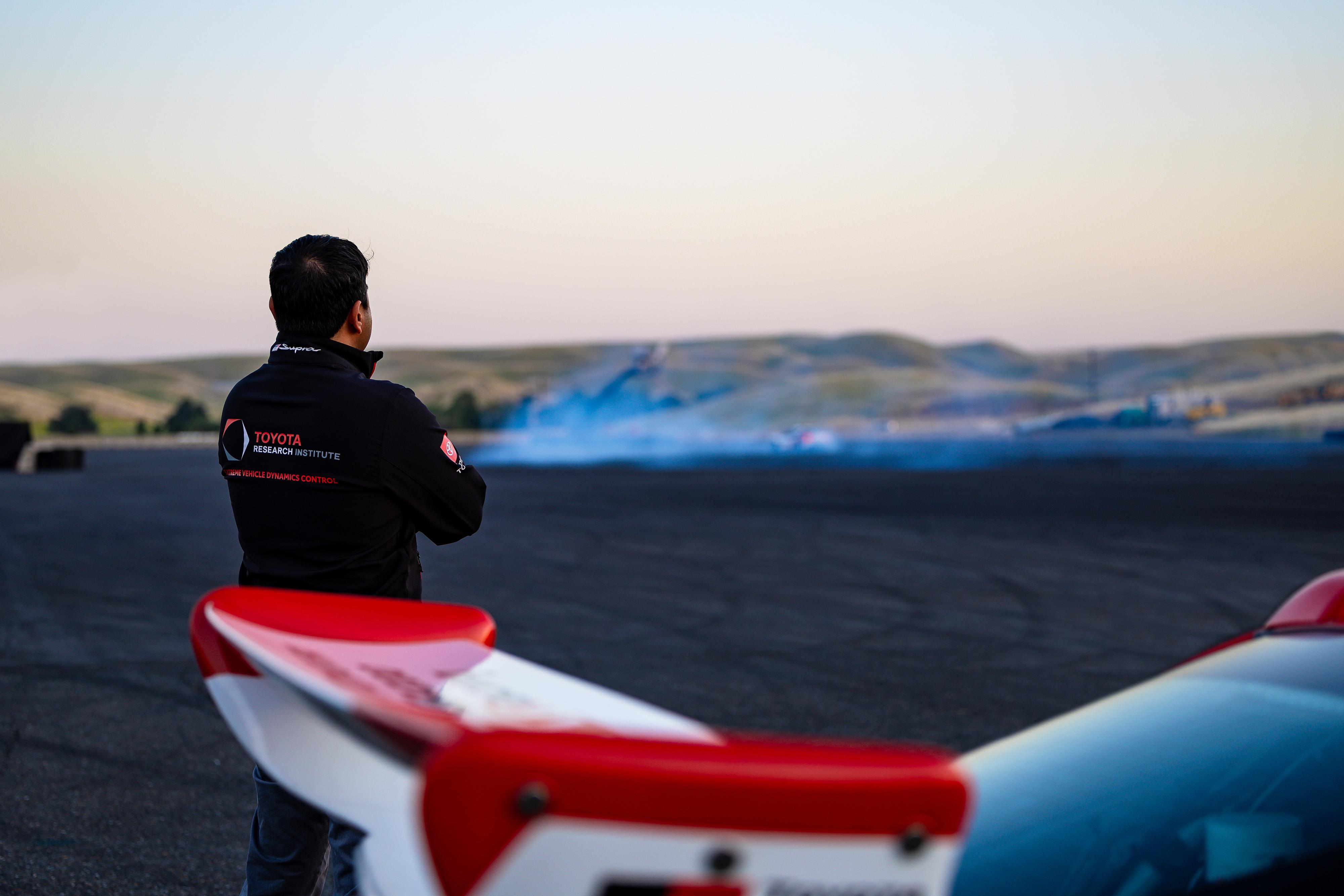 Avinash Balachandran (VP of TRI’s Human Interactive Driving division) watches a Toyota Supra autonomously drift at Thunderhill Raceway Park.