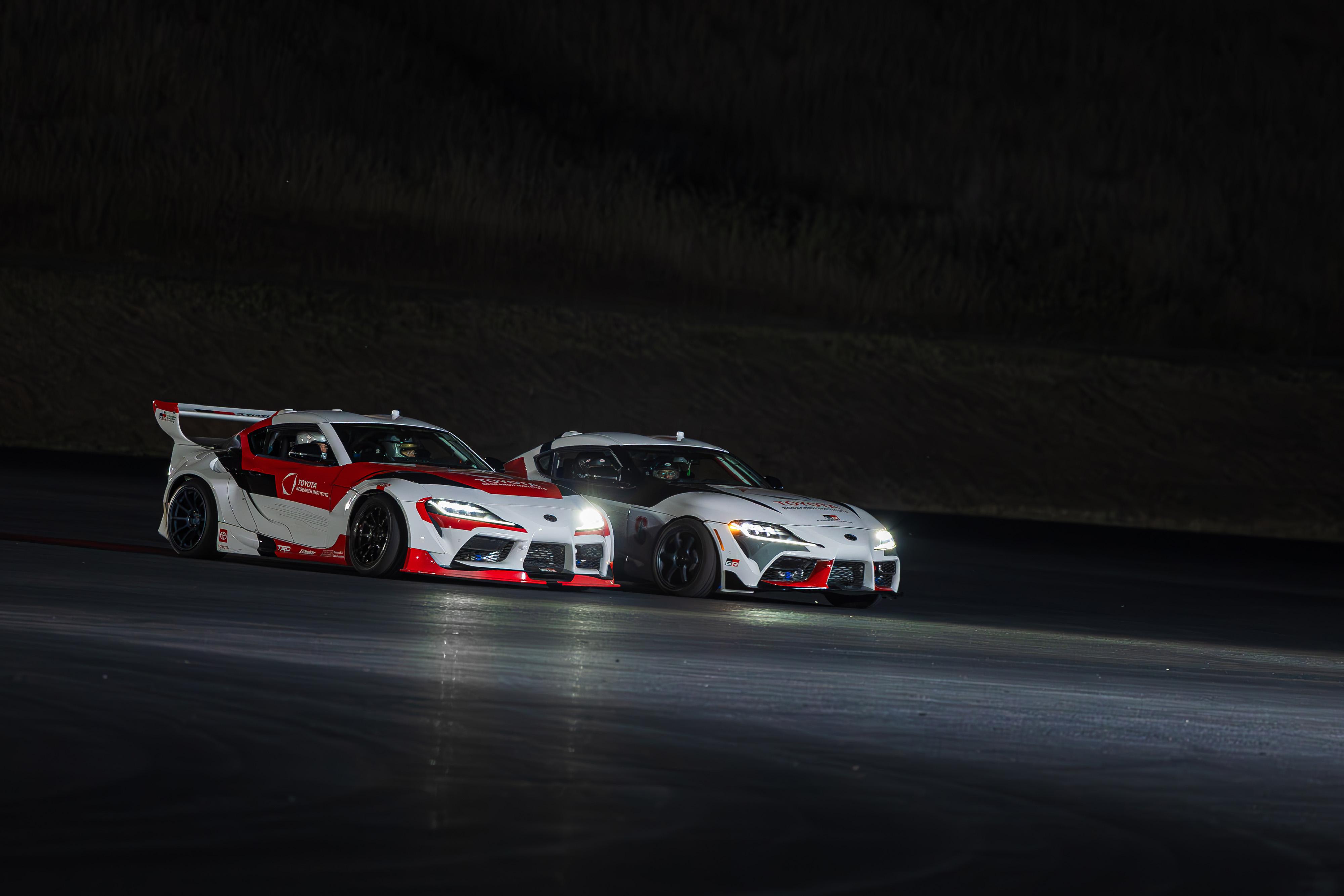 Toyota Supras in an autonomous tandem drift.